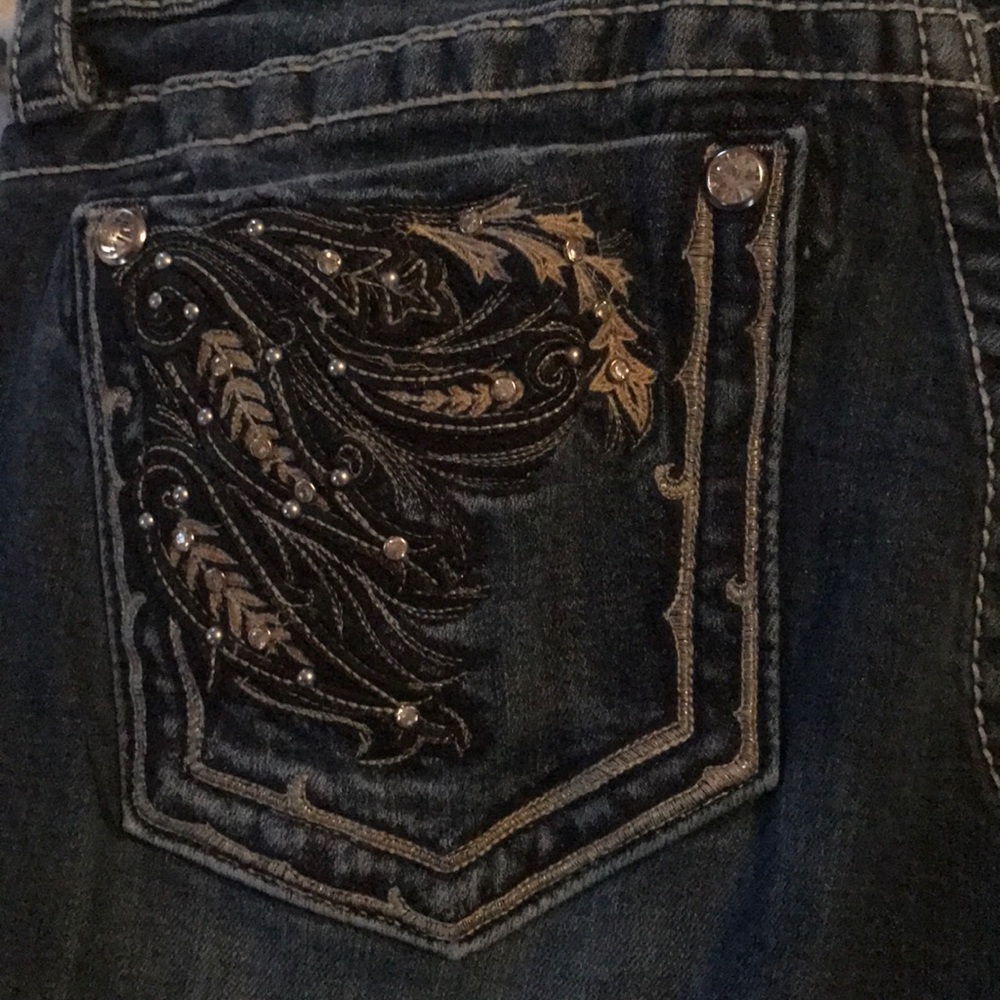 Lightly distressed boot cut Miss Me jeans